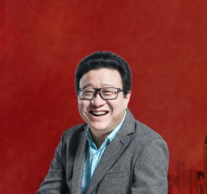 William Ding, Founder and CEO of NetEase, Inc., photographed at a tech conference, embodying his visionary leadership in China's digital landscape.