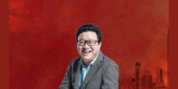 William Ding, Founder and CEO of NetEase, Inc., photographed at a tech conference, embodying his visionary leadership in China's digital landscape.
