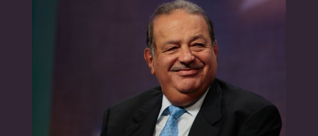 Carlos Slim Helú, CEO of Telmex and América Móvil, delivering a keynote speech at a business conference.