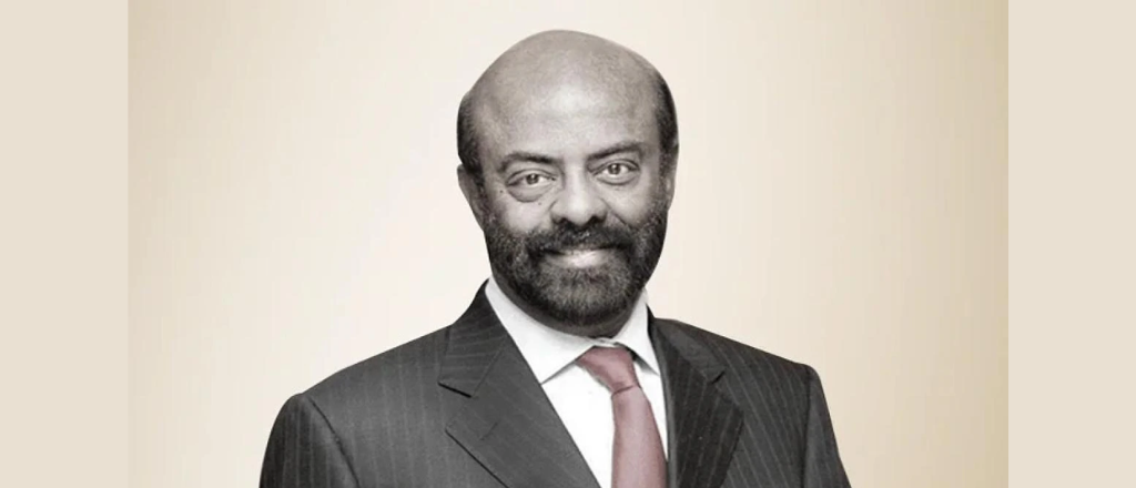 Shiv Nadar, founder of HCL Technologies, delivering a speech at an industry conference, exemplifying his visionary leadership and commitment to innovation in the IT sector.