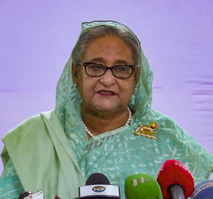 Sheikh Hasina addressing a rally, connecting with the people and advocating for their needs.