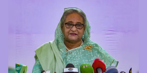 Sheikh Hasina addressing a rally, connecting with the people and advocating for their needs.