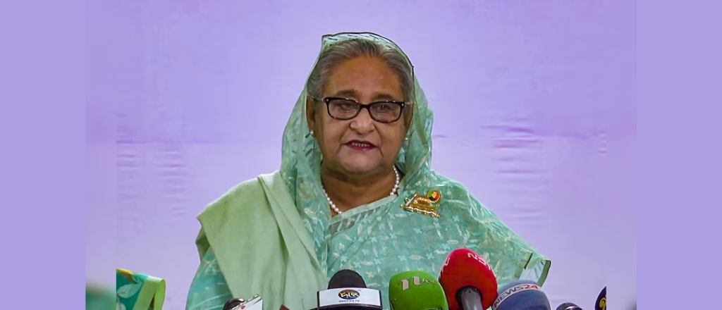 Sheikh Hasina addressing a rally, connecting with the people and advocating for their needs.