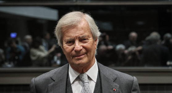 Vincent Bolloré, a billionaire businessman, transformed the Bolloré Group into a global giant in media and logistics, navigating controversies and political ties throughout his career.