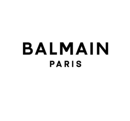 Balmain logo and exterior of the flagship store on Rue Saint-Honoré in Paris. Founded in 1945 by Pierre Balmain, the luxury fashion house is known for its haute couture designs and has dressed iconic figures like Ava Gardner and Brigitte Bardot. Under various designers, including Oscar de la Renta and Olivier Rousteing, Balmain has modernized while honoring its heritage. The brand has expanded globally, now operating over 50 stores and venturing into accessories, fragrances, and cosmetics. Balmain continues to impact contemporary fashion while upholding its legacy in haute couture.