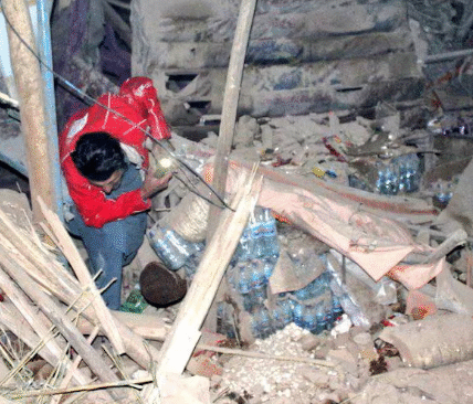 A rescuer searches for survivors after the earthquake in northern Afghanistan