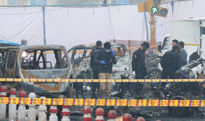 Police investigate the wreckage after a deadly car explosion near Delhi’s Red Fort.