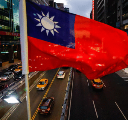 A Taiwan flag hangs above a Taipei overpass as the city prepares for National Day.