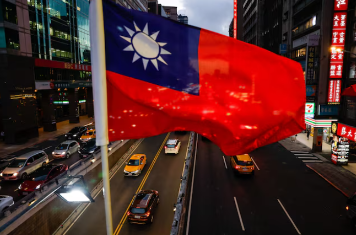 A Taiwan flag hangs above a Taipei overpass as the city prepares for National Day.