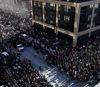 Thousands gather in downtown Minneapolis for a mass protest against federal immigration enforcement