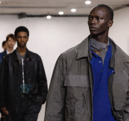 Models present looks from the Men’s Fall/Winter 2026 collection during the Paul Smith show at Milan Men’s Fashion Week.