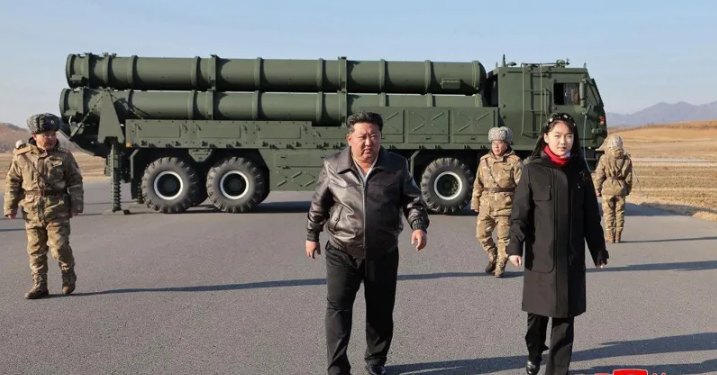 Kim Jong Un walks alongside his daughter Kim Ju Ae during a high-profile military event